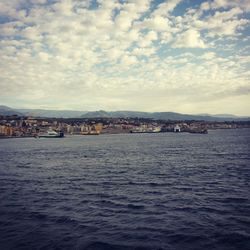 Scenic view of sea against cloudy sky