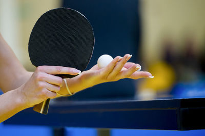 Woman playing table tennis in court