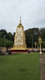 Statue of temple against building