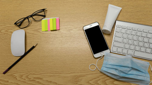 High angle view of smart phone on table