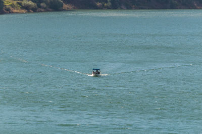 People on boat in sea