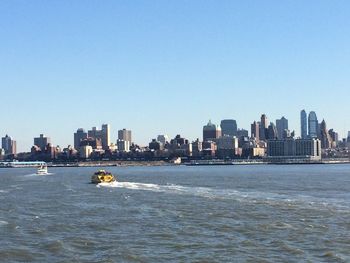 City skyline with sea in background