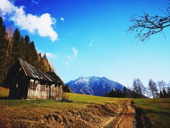 Scenic view of landscape against blue sky