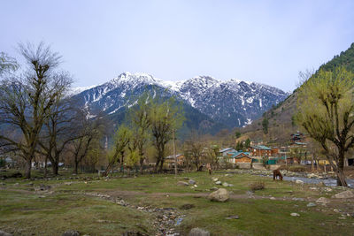 Scenic view of snowcapped mountains against sky