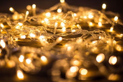 Close-up of illuminated string lights on table