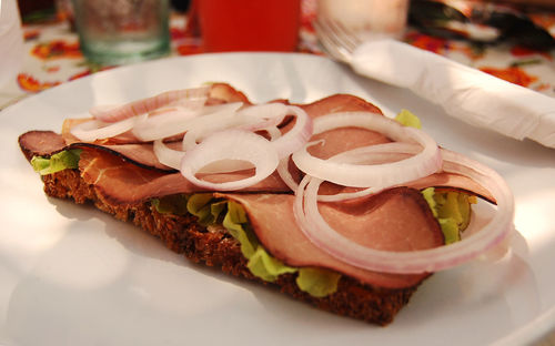 Open sandwich in a plate served in a restaurant