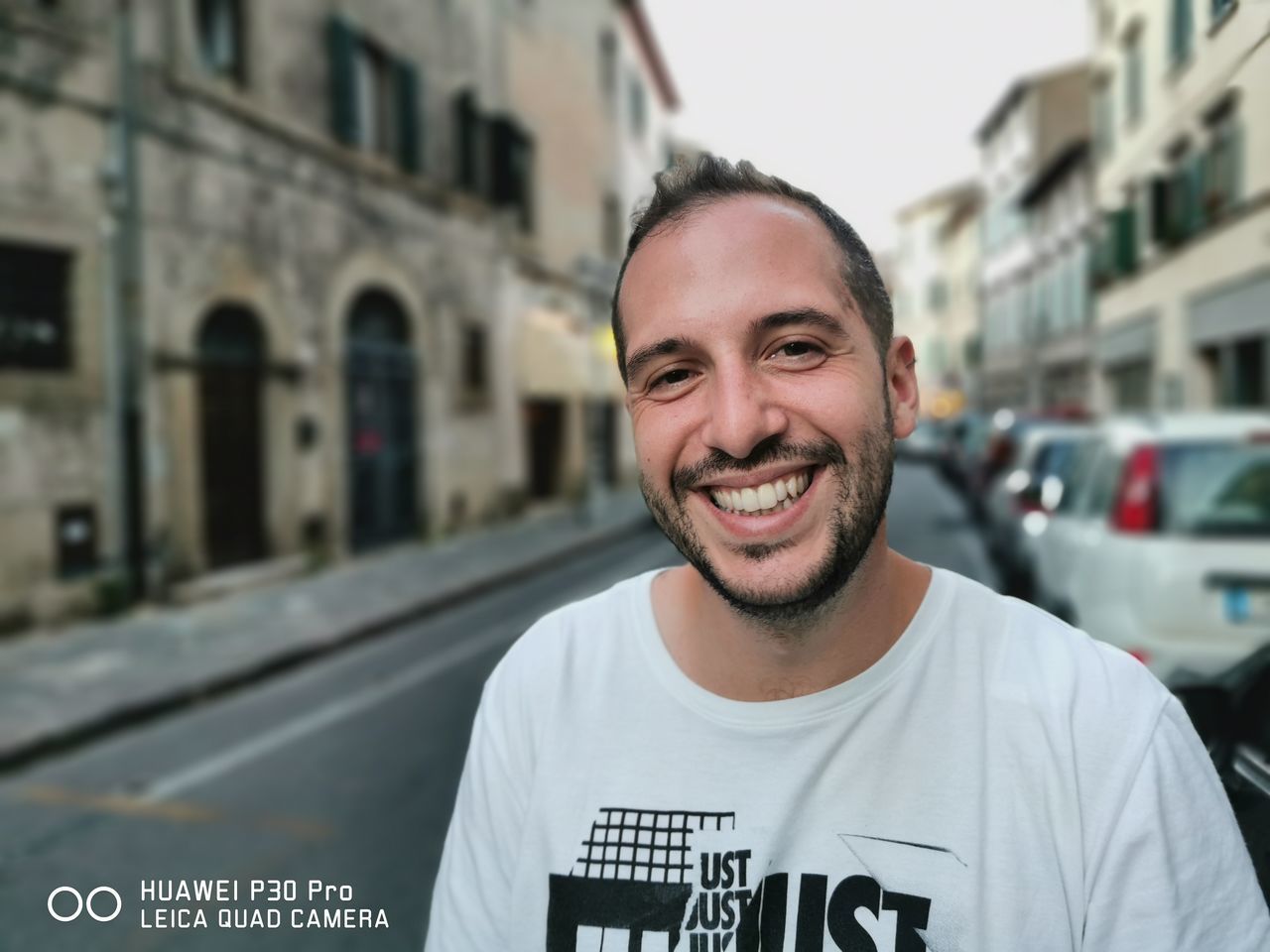 PORTRAIT OF A SMILING YOUNG MAN