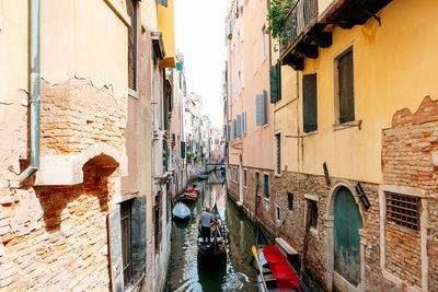 Narrow alley amidst buildings in city