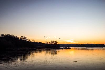 Scenic view of lake at sunset