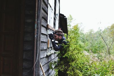 Man peeking through window 