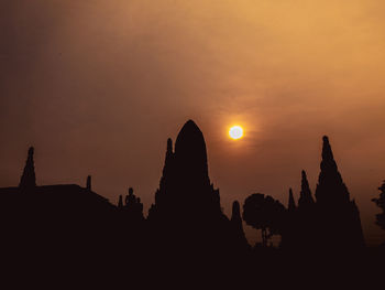 Silhouette temple against sky during sunset