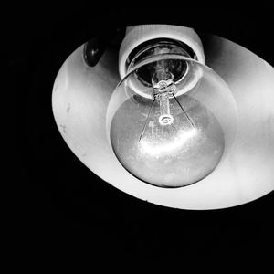 Low angle view of illuminated light bulb