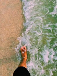 Low section of person at beach