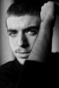 Close-up portrait of young man looking away