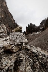 Low angle view of rock formation against sky