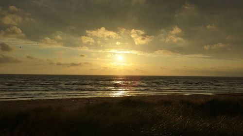 Scenic view of sea at sunset