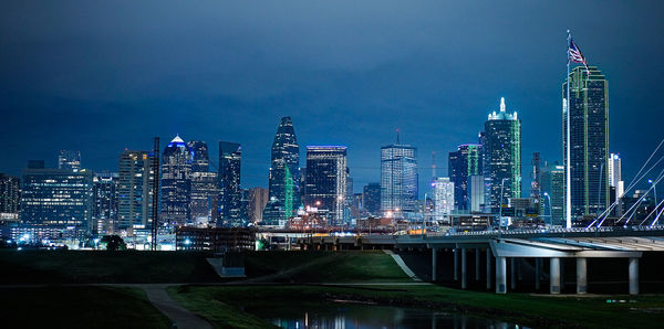 Illuminated buildings in city at night