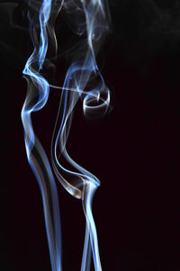 Close-up of smoke against black background