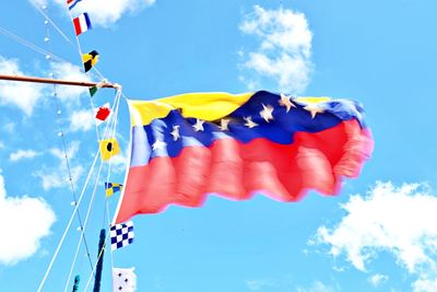 Low angle view of venezuelan  flag against sky
