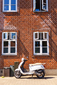 Street against brick wall of building