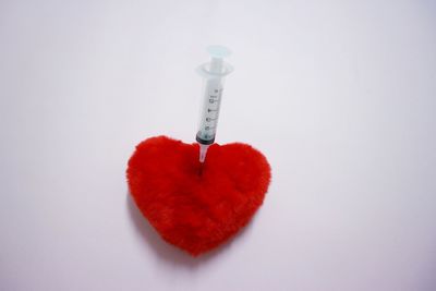 Close-up of heart shape over white background