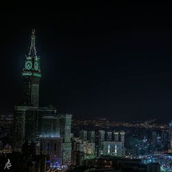 Illuminated buildings in city at night