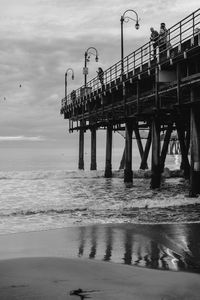 Pier on sea against sky