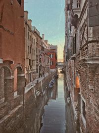 Canal amidst buildings in town