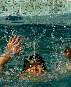 Close-up of boy swimming in sea