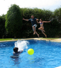 Full length of girl playing in water