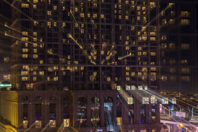 Illuminated buildings in city at night