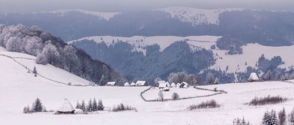 Scenic view of mountains against sky during winter