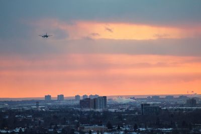 Cityscape against sky during sunset