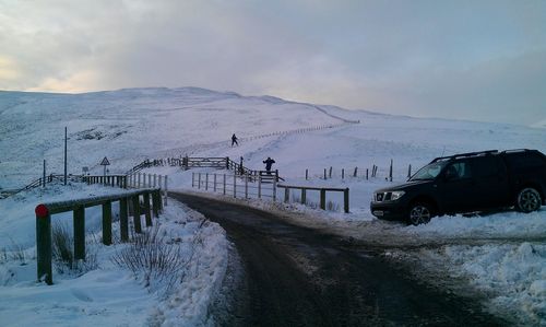 Scenic view of snow covered mountain against sky