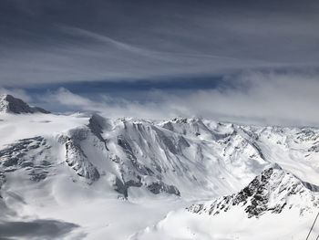 Scenic view of snowcapped mountains against sky