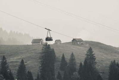 View of overhead cable car against sky