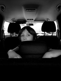 Portrait of boy sitting in car