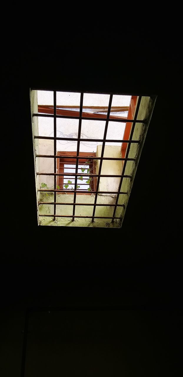 LOW ANGLE VIEW OF ILLUMINATED SKYLIGHT