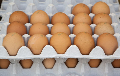 Stack of eggs at display for sale
