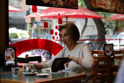 Woman sitting in restaurant
