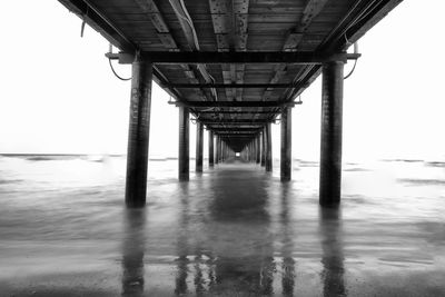 Pier over sea against sky
