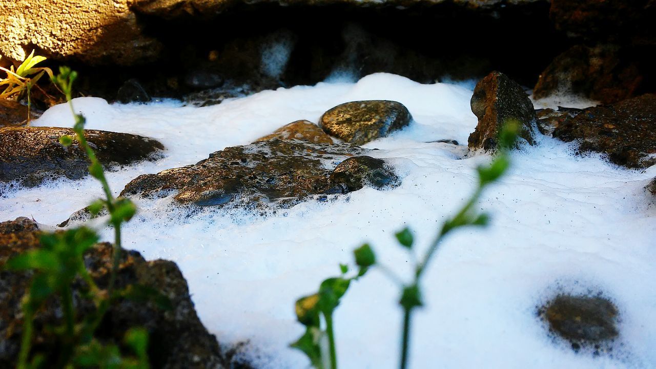 water, rock - object, waterfall, nature, flowing water, motion, beauty in nature, rock formation, flowing, stream, plant, rock, scenics, long exposure, tranquility, moss, day, close-up, outdoors, high angle view