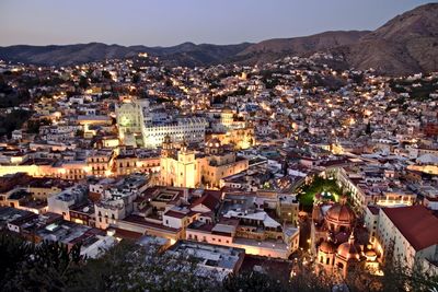 High angle shot of townscape against sky at night