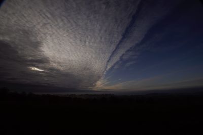 Scenic view of silhouette landscape against sky at sunset