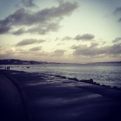 Scenic view of sea against cloudy sky