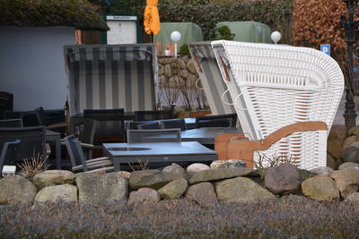 Empty chairs and tables at an outdoor restaurant