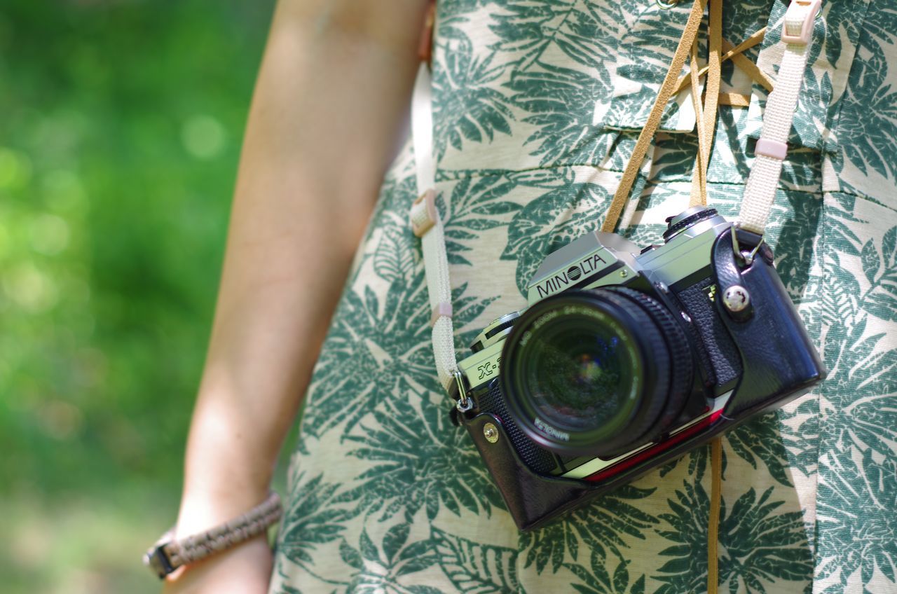 lifestyles, leisure activity, person, holding, part of, cropped, focus on foreground, close-up, tree, day, men, outdoors, unrecognizable person, midsection, photographing, reflection