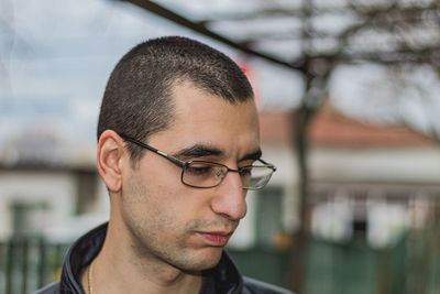 Portrait of young man looking away