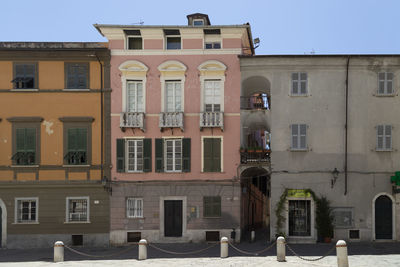 Low angle view of buildings against clear sky