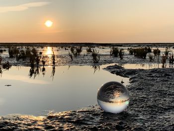 Scenic view of sea against sky during sunset